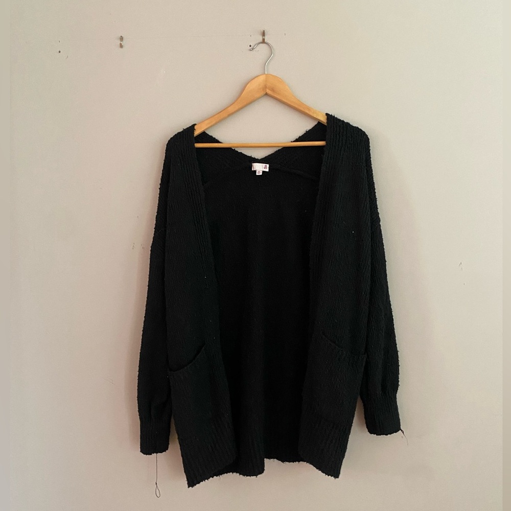 XS black cardigan with two front pockets